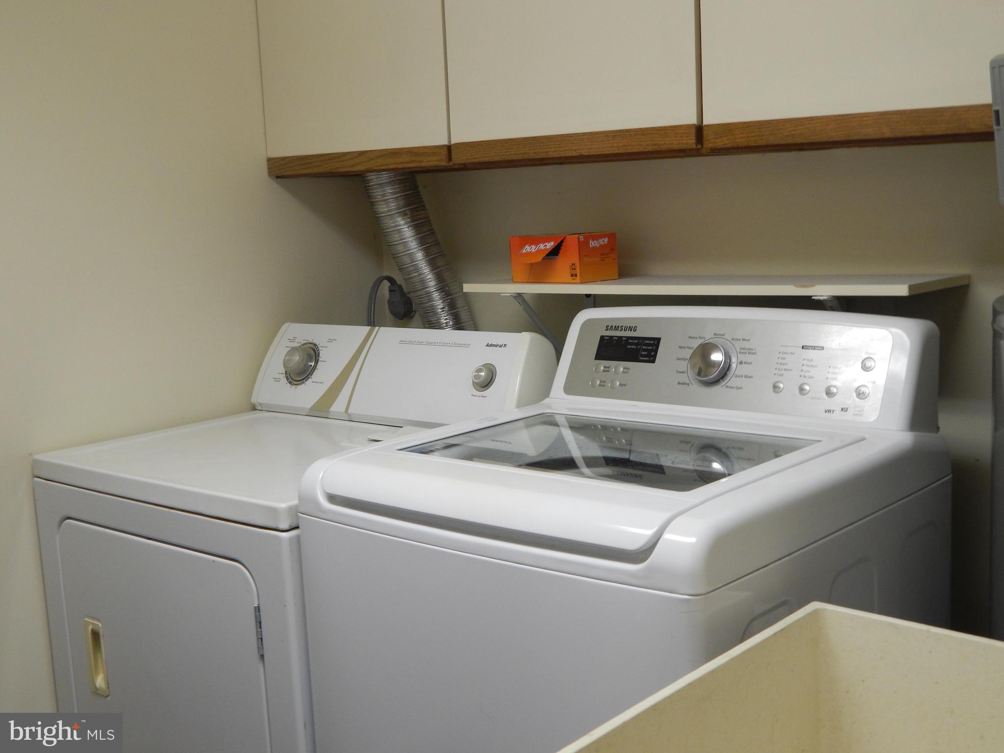 100 Castletown Road, Unit 101 Lutherville-Timonium, MD 21093 - Photo 14 of 18 a utility room with dryer and washer