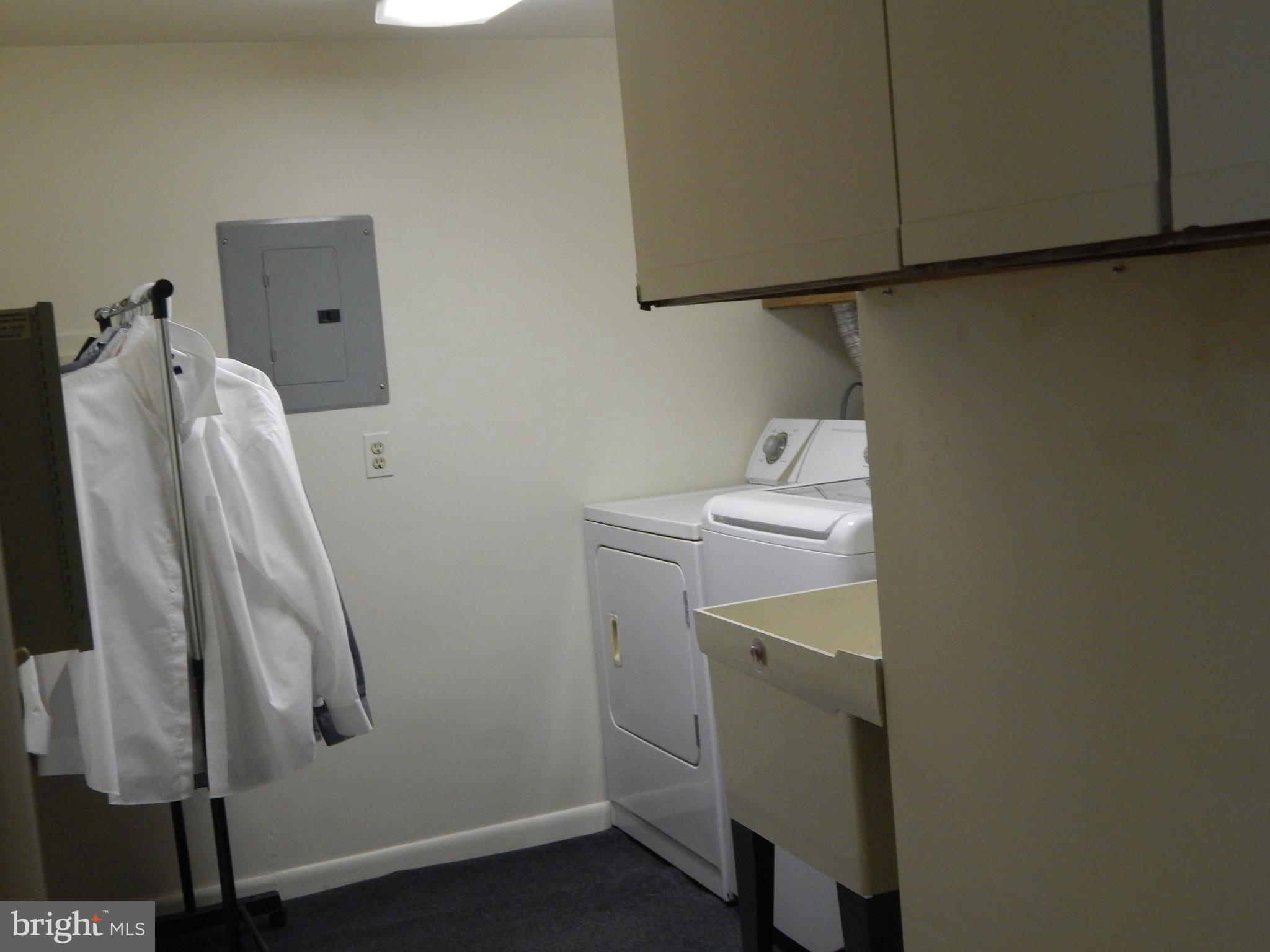 100 Castletown Road, Unit 101 Lutherville-Timonium, MD 21093 - Photo 15 of 18 a utility room with dryer and washer