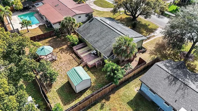 an aerial view of house with yard