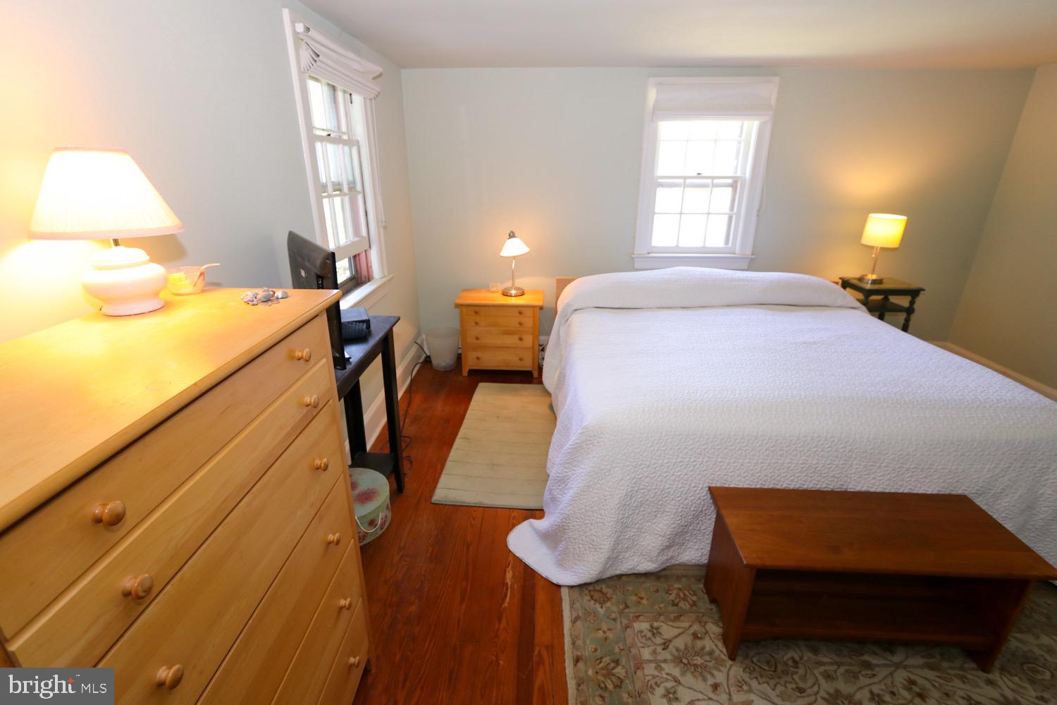 2701 Alden Road Bryn Athyn, PA 19006 - Photo 67 of 105 a bedroom with a bed and wooden floor