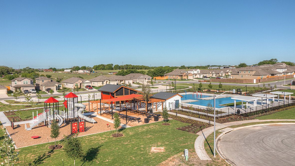 490 Evergreen Sumac Loop Kyle, TX 78640 - Photo 27 of 35 Aerial perspective of suburban area with a park