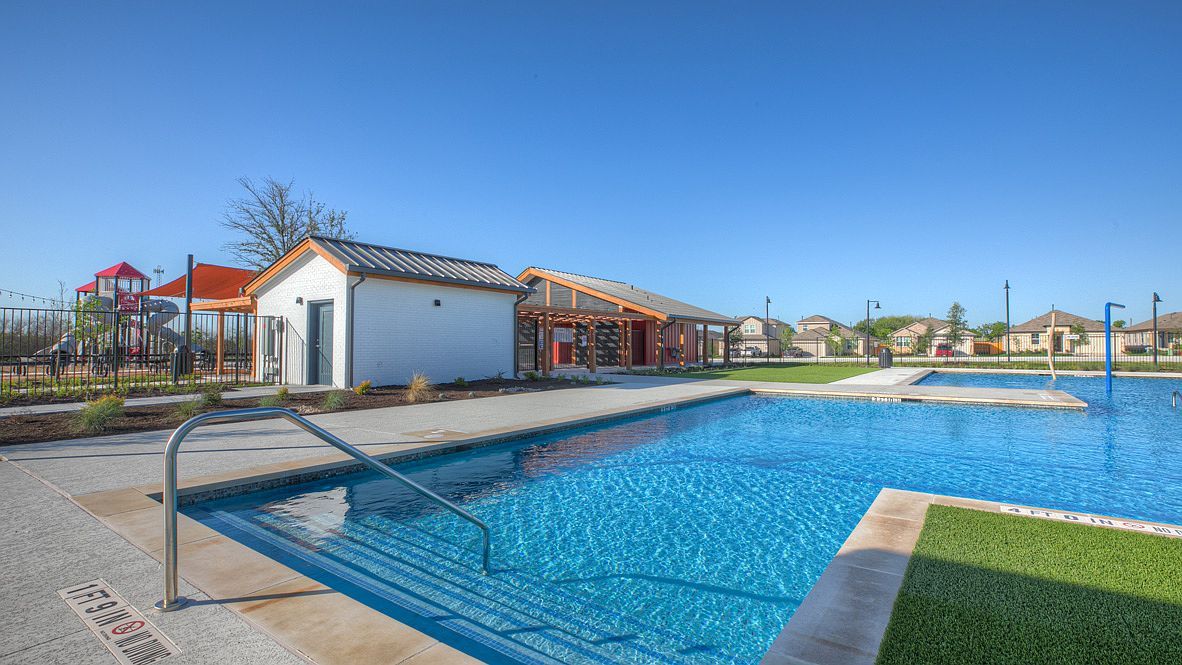 490 Evergreen Sumac Loop Kyle, TX 78640 - Photo 33 of 35 Community pool featuring a residential view and a patio area