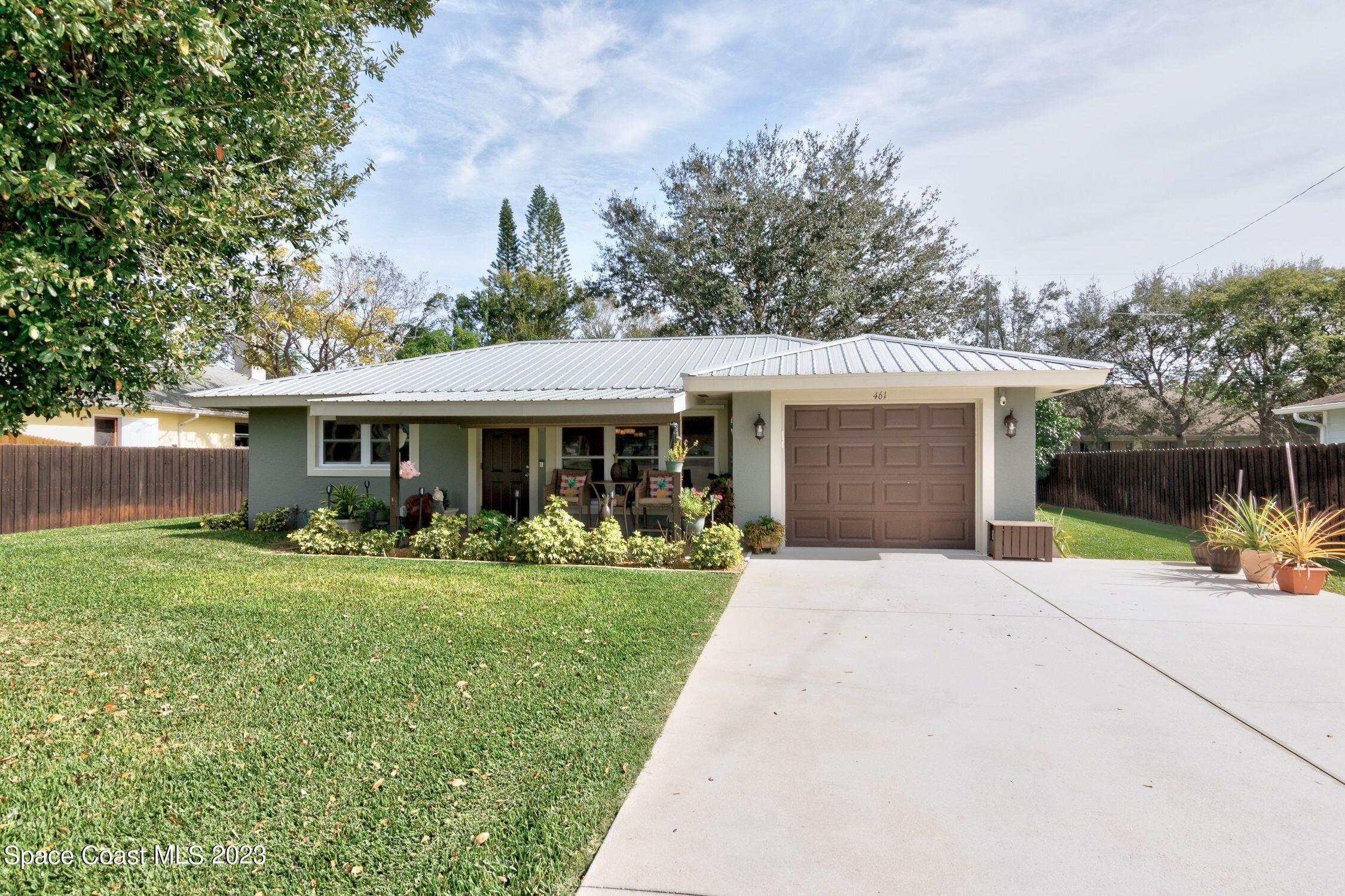 461 Easy Street Sebastian, FL 32958 - Photo 2 of 31 a front view of house with yard and green space