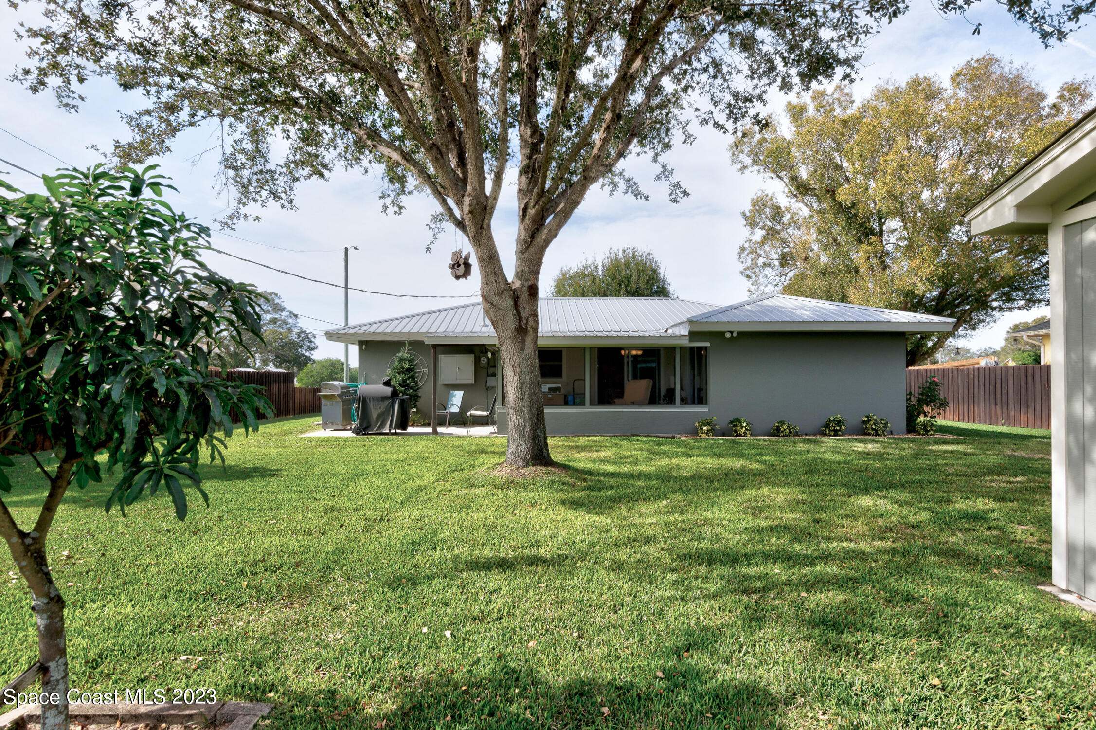 461 Easy Street Sebastian, FL 32958 - Photo 23 of 31 a view of a house with a yard and tree