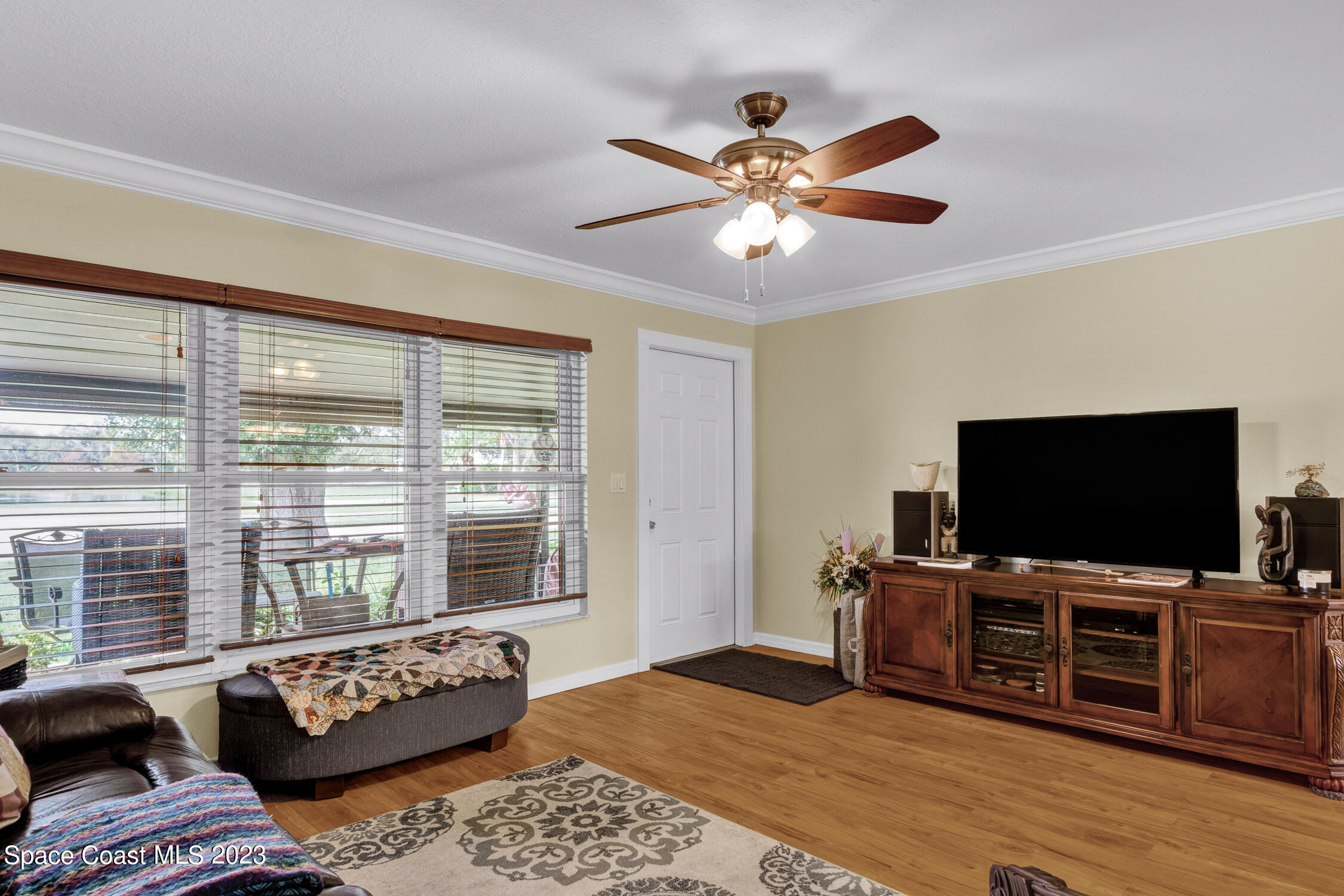 461 Easy Street Sebastian, FL 32958 - Photo 9 of 31 a living room with furniture and a flat screen tv