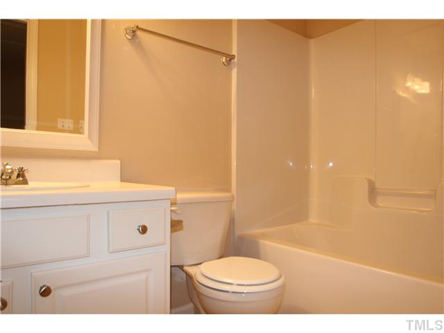 5308 Glen Canyon Road Raleigh, NC 27616 - Photo 11 of 12 a bathroom with a sink a toilet and shower