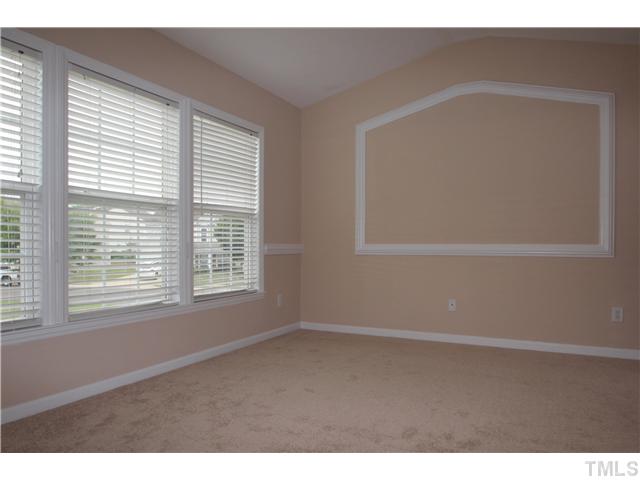 5308 Glen Canyon Road Raleigh, NC 27616 - Photo 8 of 12 a view of an empty room with a window