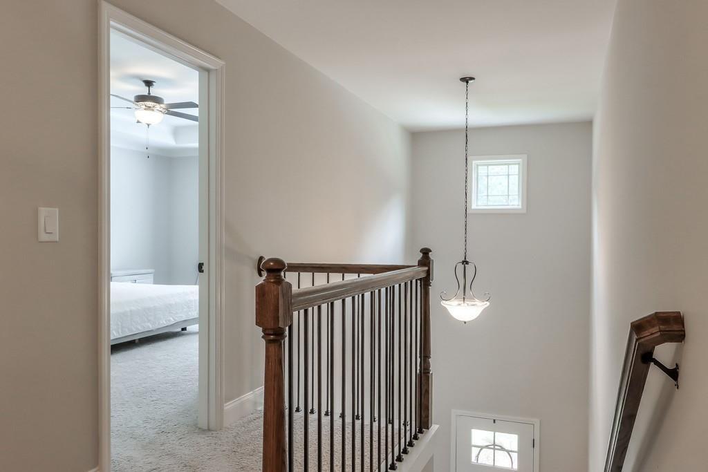 4688 Cantrell Road Flowery Branch, GA 30542 - Photo 20 of 39 a view of a hallway with a livingroom and a window