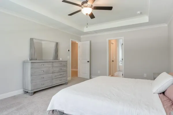 a bedroom with a bed and a dresser