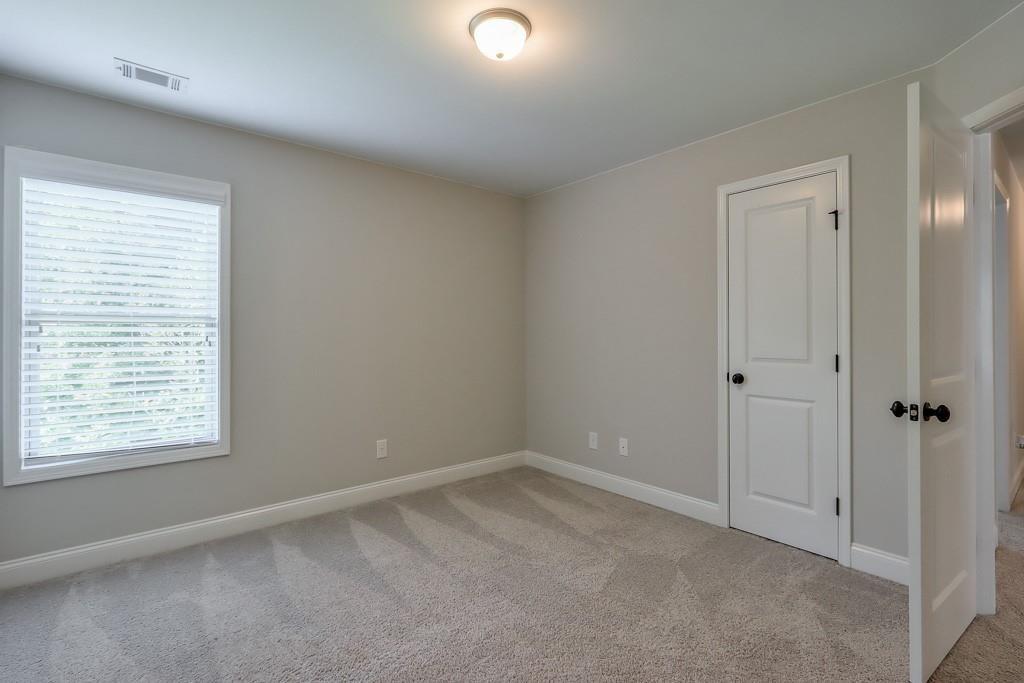 4688 Cantrell Road Flowery Branch, GA 30542 - Photo 29 of 39 a view of an empty room with a window