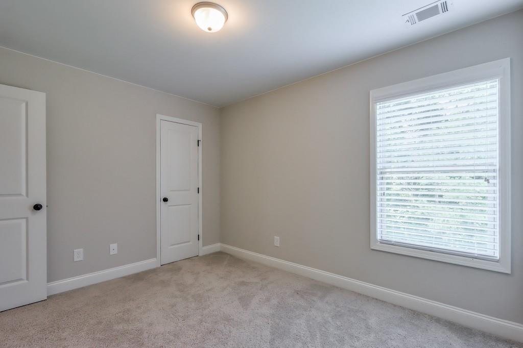 4688 Cantrell Road Flowery Branch, GA 30542 - Photo 30 of 39 a view of an empty room with a window