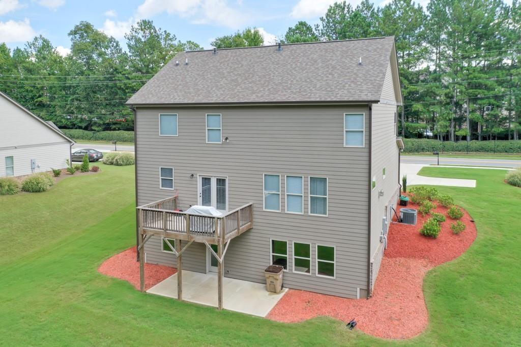 4688 Cantrell Road Flowery Branch, GA 30542 - Photo 33 of 39 a aerial view of a house with a yard table and chairs