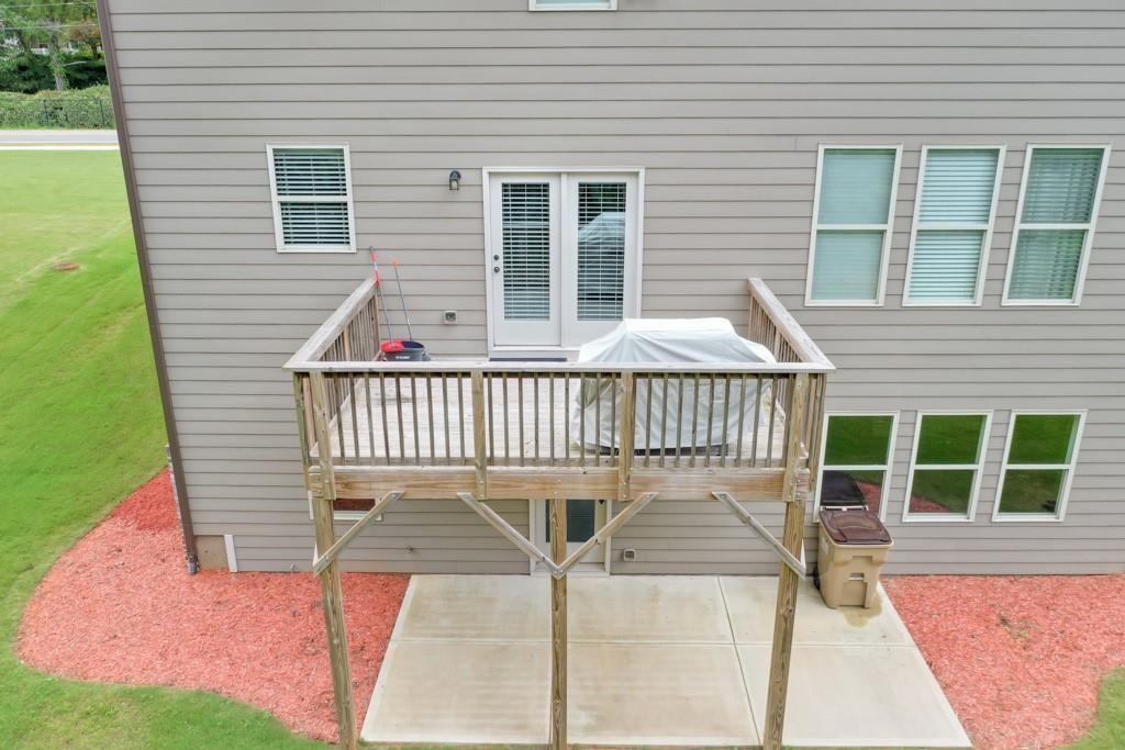4688 Cantrell Road Flowery Branch, GA 30542 - Photo 34 of 39 a view of a house with a deck