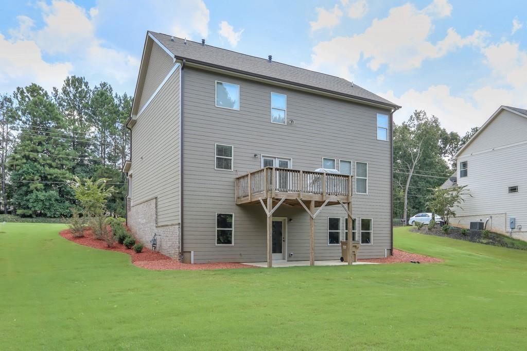 4688 Cantrell Road Flowery Branch, GA 30542 - Photo 35 of 39 a front view of a house with a yard