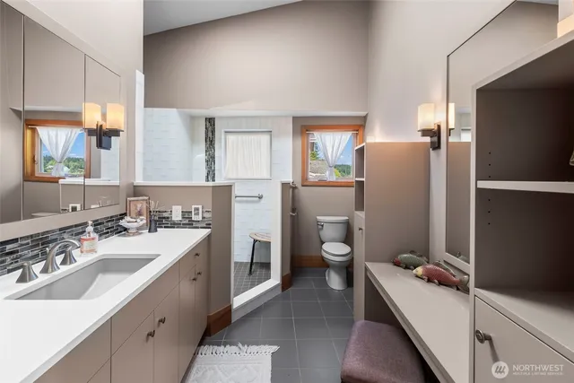 a bathroom with a sink toilet and tub