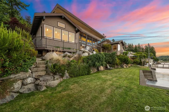 a front view of a house with a garden