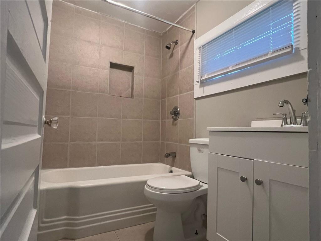 21 Quarry Street Gainesville, GA 30501 - Photo 6 of 8 a bathroom with a sink a toilet and shower