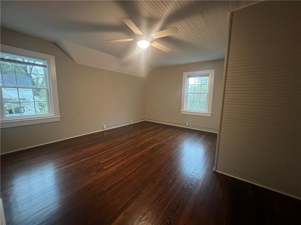 21 Quarry Street Gainesville, GA 30501 - Photo 7 of 8 an empty room with wooden floor and windows