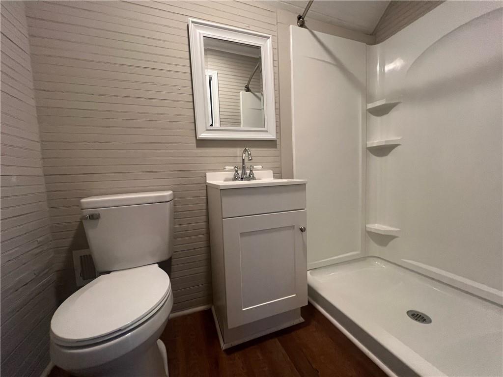 21 Quarry Street Gainesville, GA 30501 - Photo 8 of 8 a bathroom with a sink a toilet and a mirror