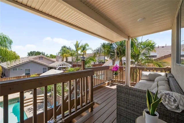 a view of balcony with furniture