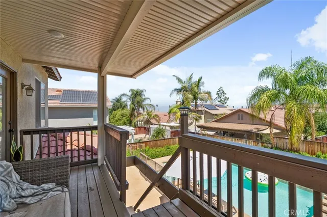 a view of a balcony with furniture
