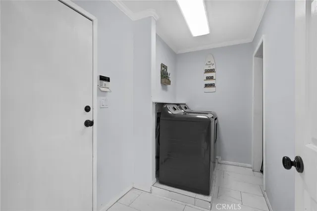 a view of storage and utility room with washer and dryer