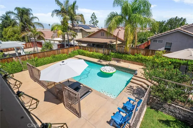 a view of house with swimming pool yard outdoor seating