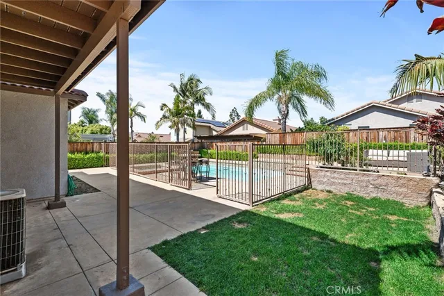 a view of a house with a yard and porch
