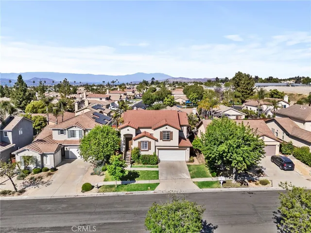 an aerial view of a house with a garden