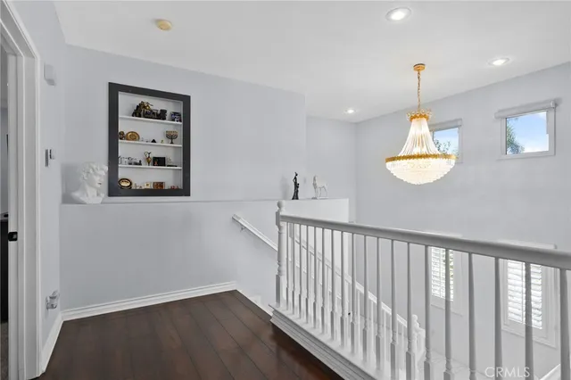 a view of a hallway with a chandelier