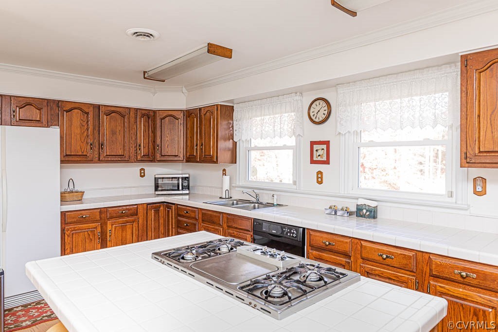 18162 Teman Road Beaverdam, VA 23015 - Photo 13 of 47 a kitchen with stainless steel appliances a sink stove and window