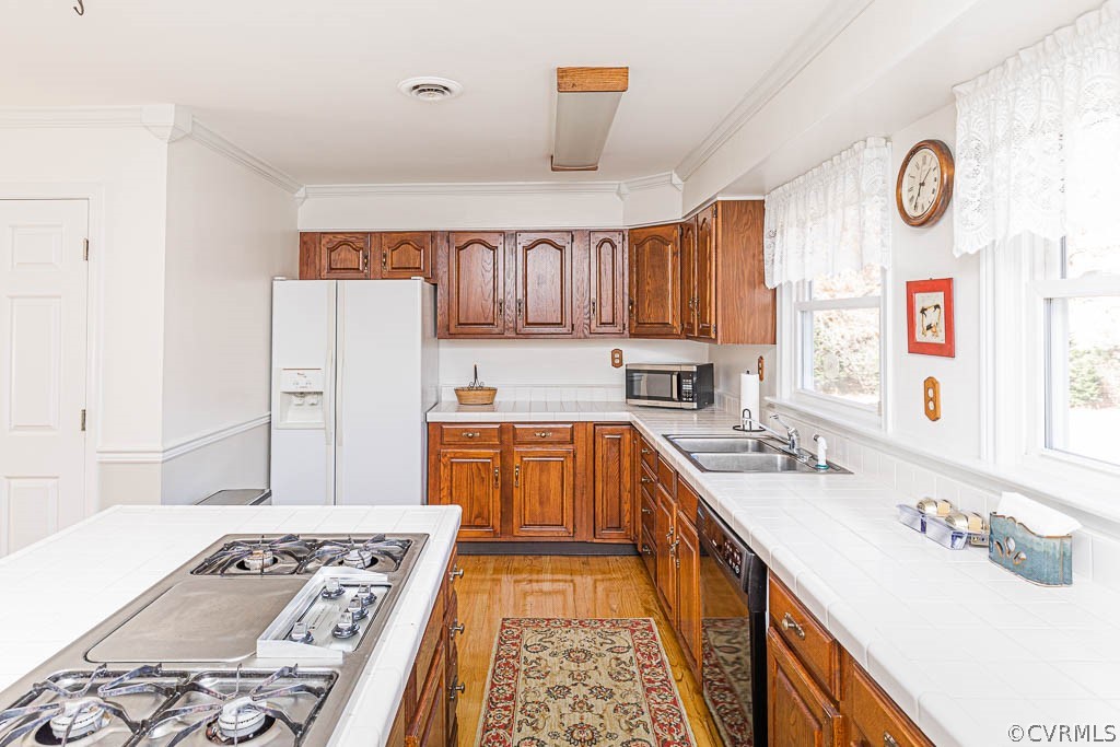 18162 Teman Road Beaverdam, VA 23015 - Photo 14 of 47 a kitchen with a sink stove and refrigerator