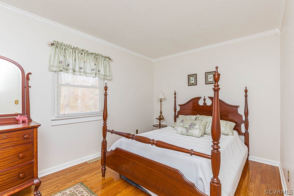 18162 Teman Road Beaverdam, VA 23015 - Photo 24 of 47 a bedroom with a bed and wooden floor