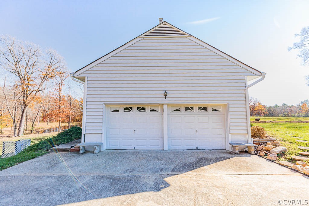 18162 Teman Road Beaverdam, VA 23015 - Photo 35 of 47 a view of a house with a yard and garage