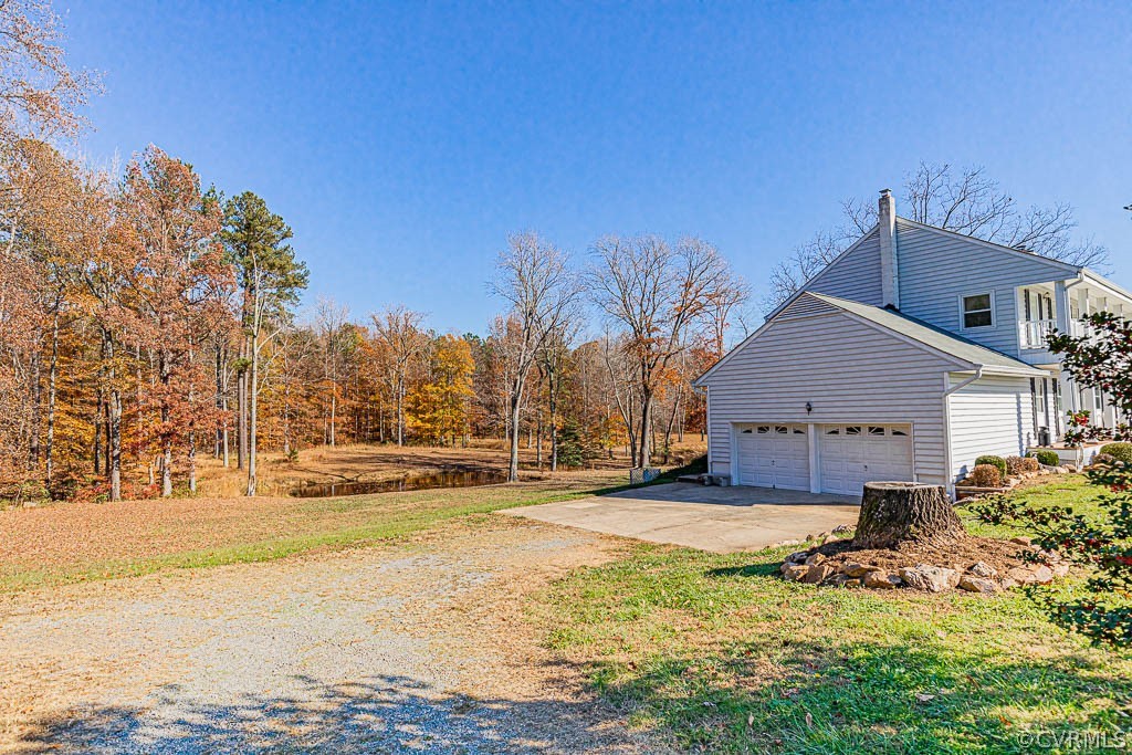 18162 Teman Road Beaverdam, VA 23015 - Photo 37 of 47 a view of a house with a yard covered with snow in the background