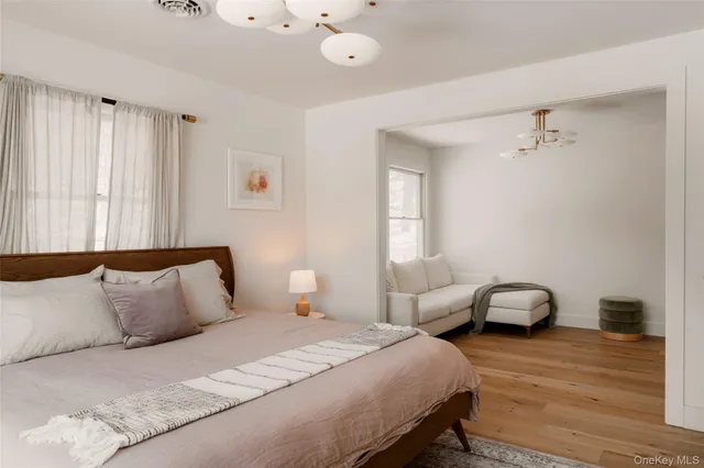 a bedroom with bed and a window