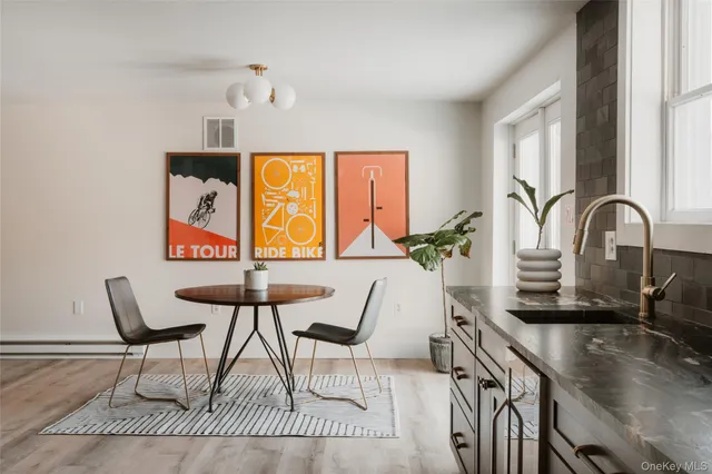 a dining room with furniture and window