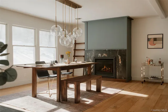 a view of a dining room with furniture window and wooden floor