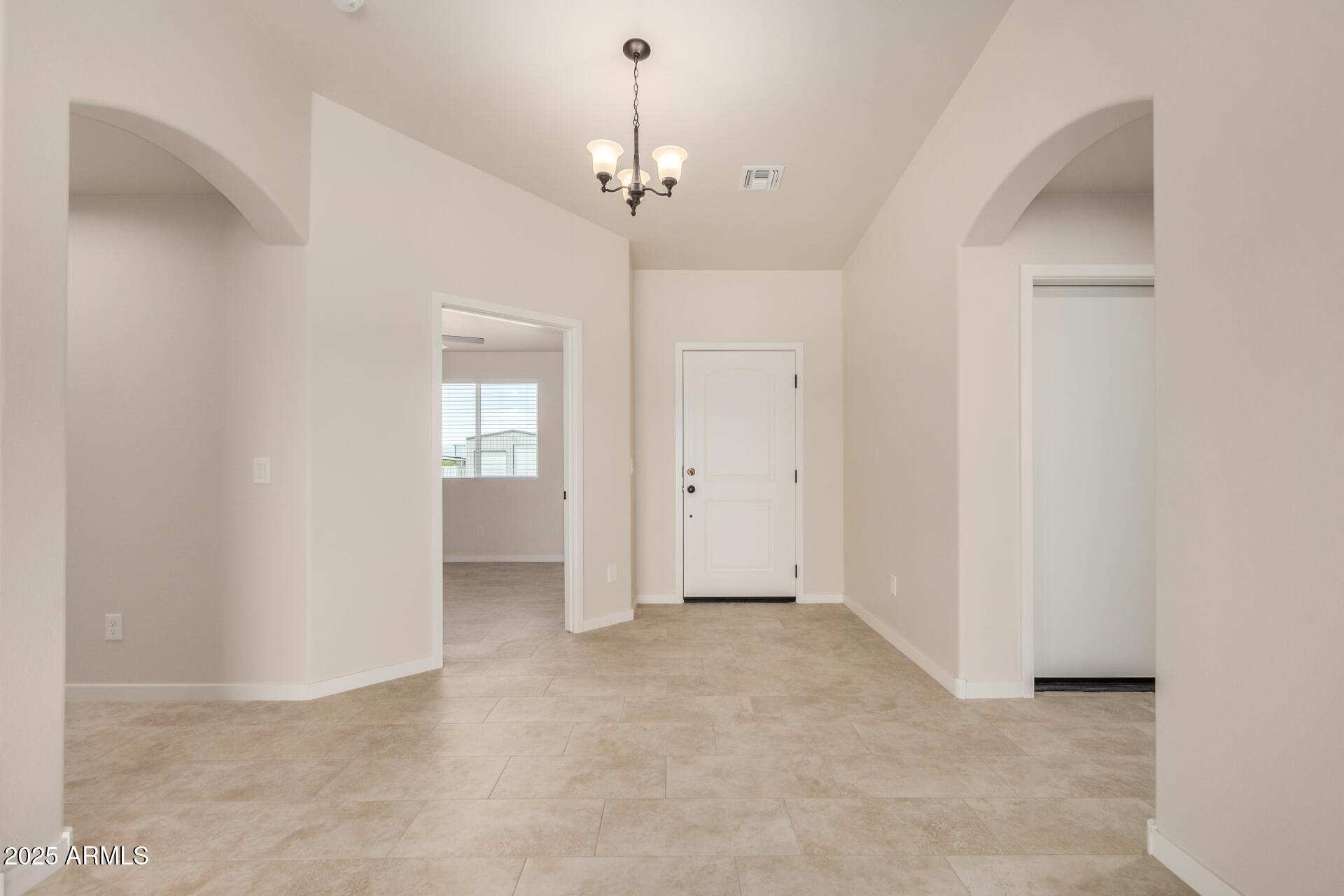20375 West Carver Road Buckeye, AZ 85326 - Photo 10 of 44 a view of an empty room with a window