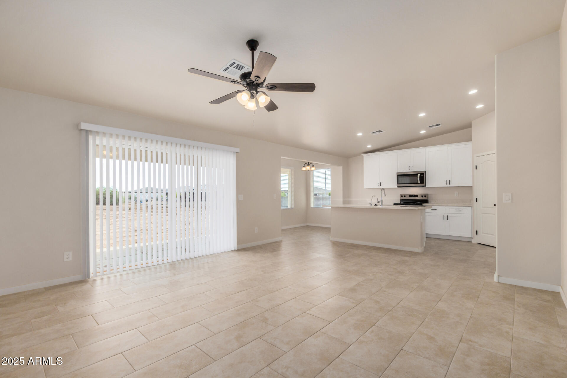20375 West Carver Road Buckeye, AZ 85326 - Photo 13 of 44 a view of an empty room with a window