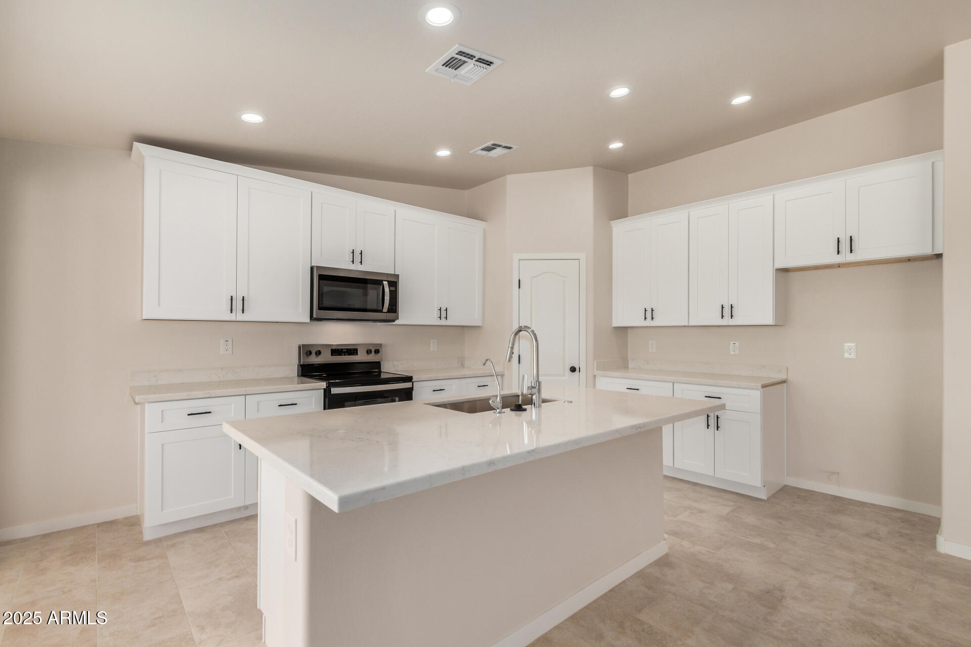 20375 West Carver Road Buckeye, AZ 85326 - Photo 16 of 44 a kitchen with white cabinets appliances and sink