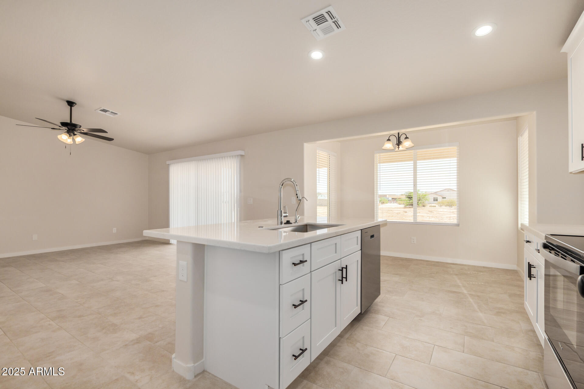 20375 West Carver Road Buckeye, AZ 85326 - Photo 18 of 44 a kitchen with a sink stove and cabinets
