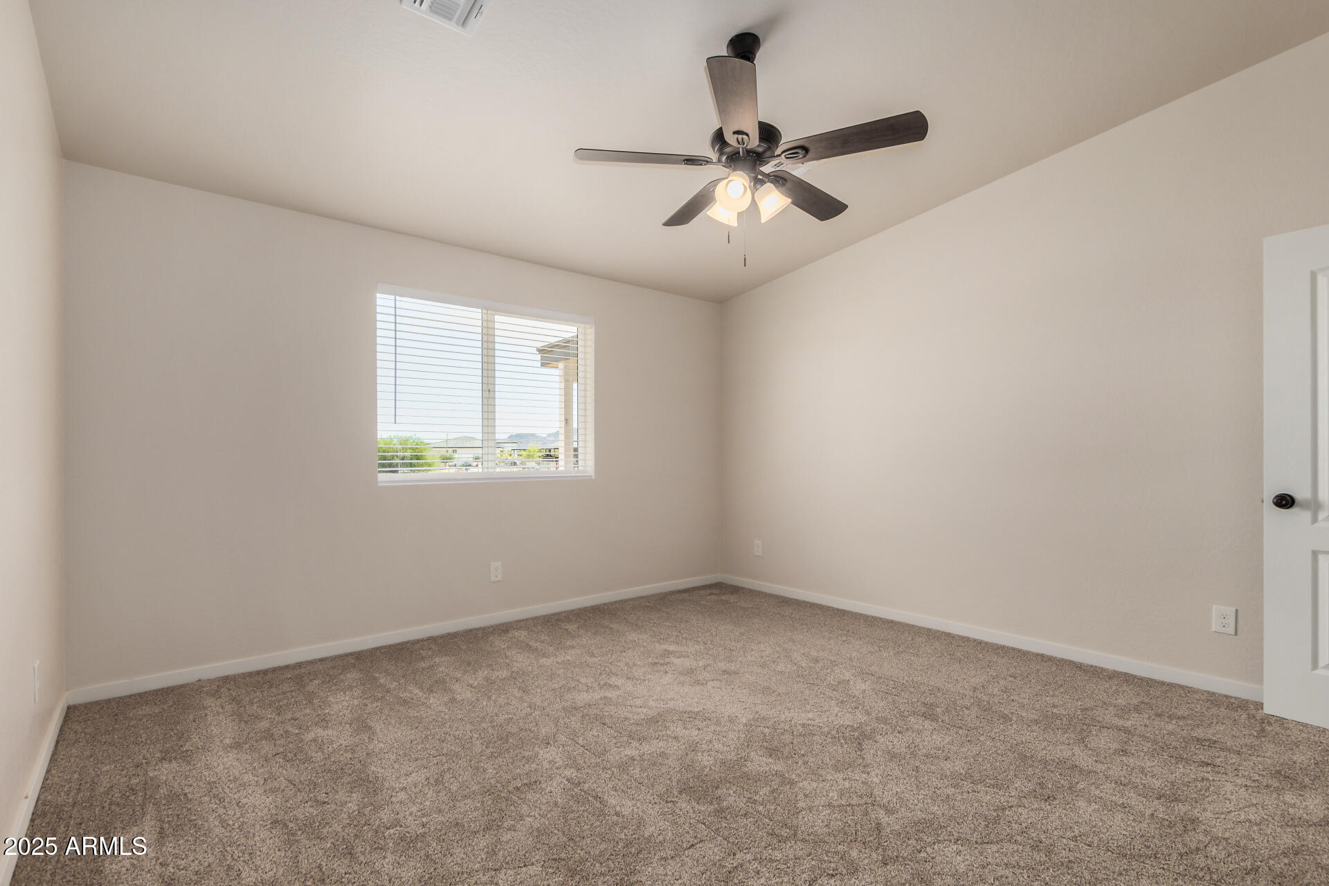 20375 West Carver Road Buckeye, AZ 85326 - Photo 20 of 44 a view of an empty room with a window