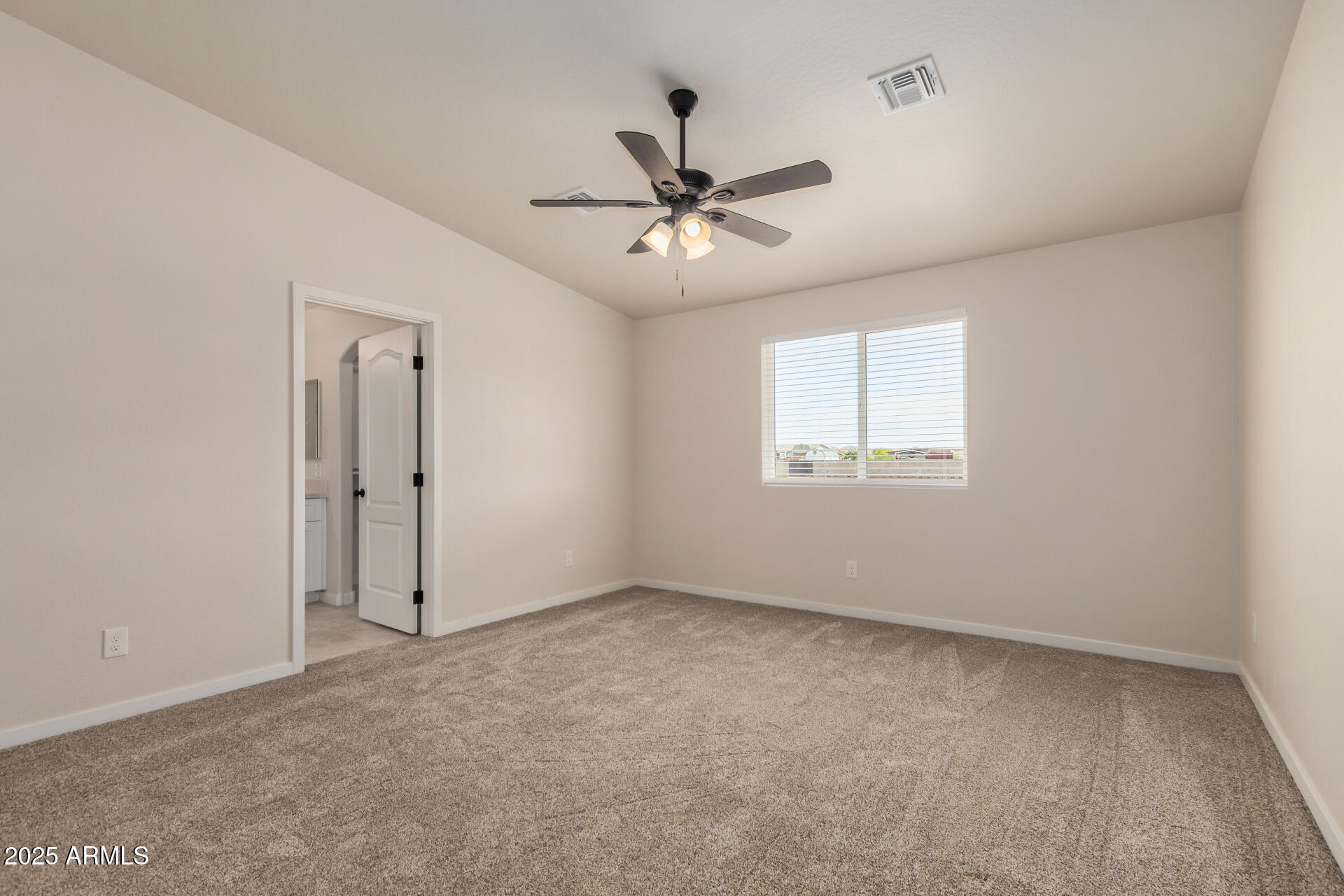 20375 West Carver Road Buckeye, AZ 85326 - Photo 22 of 44 a view of an empty room with a window