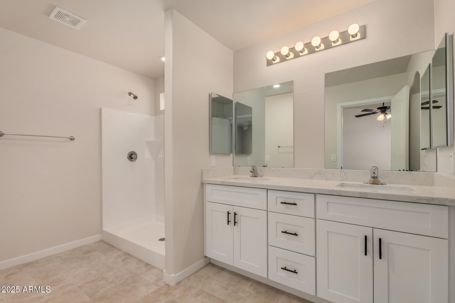 20375 West Carver Road Buckeye, AZ 85326 - Photo 23 of 44 a bathroom with double sink and a mirror