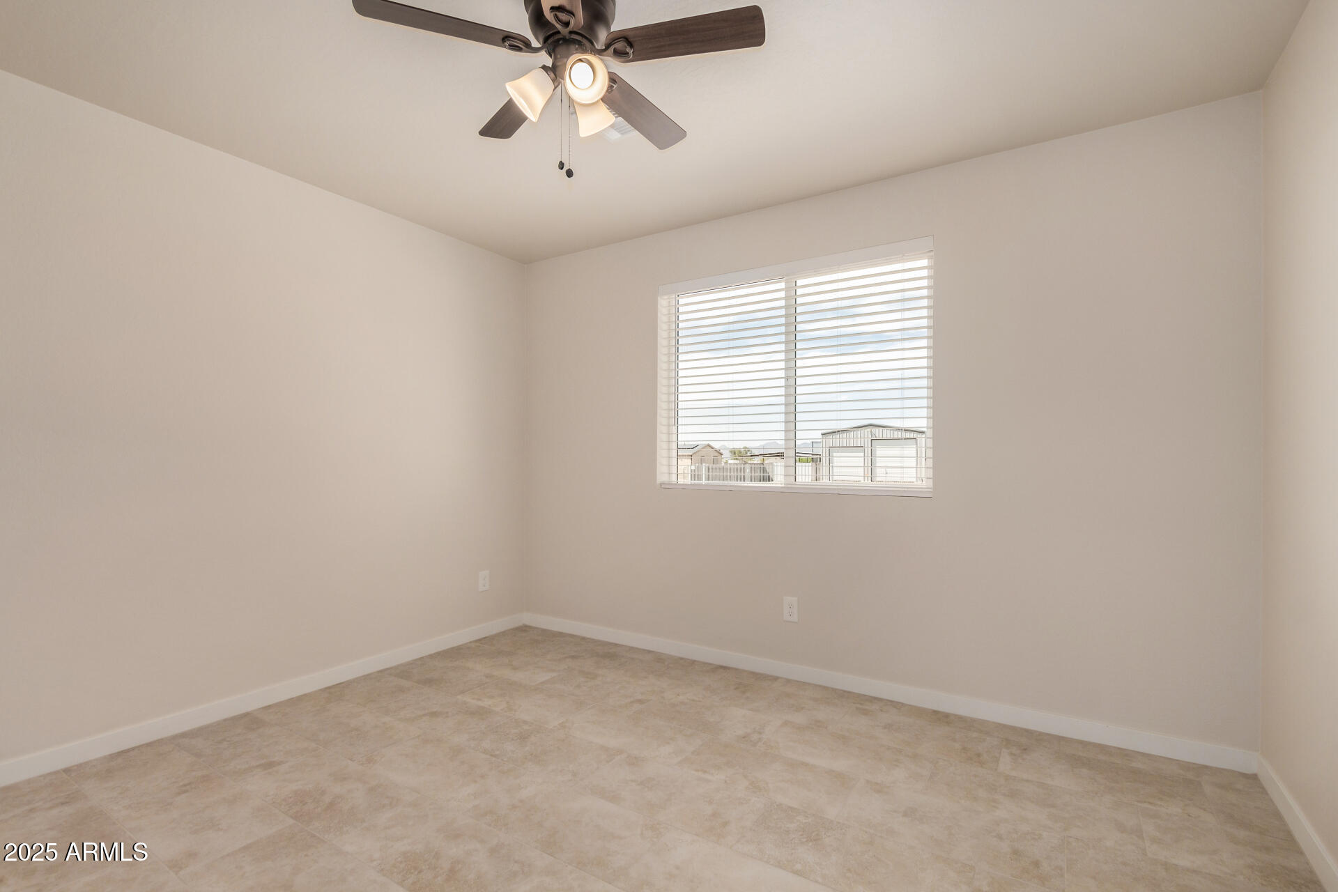 20375 West Carver Road Buckeye, AZ 85326 - Photo 27 of 44 an empty room with a window