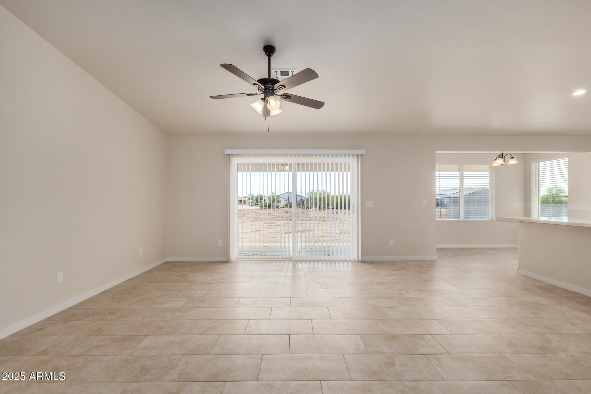 20375 West Carver Road Buckeye, AZ 85326 - Photo 6 of 44 a view of an empty room with a window