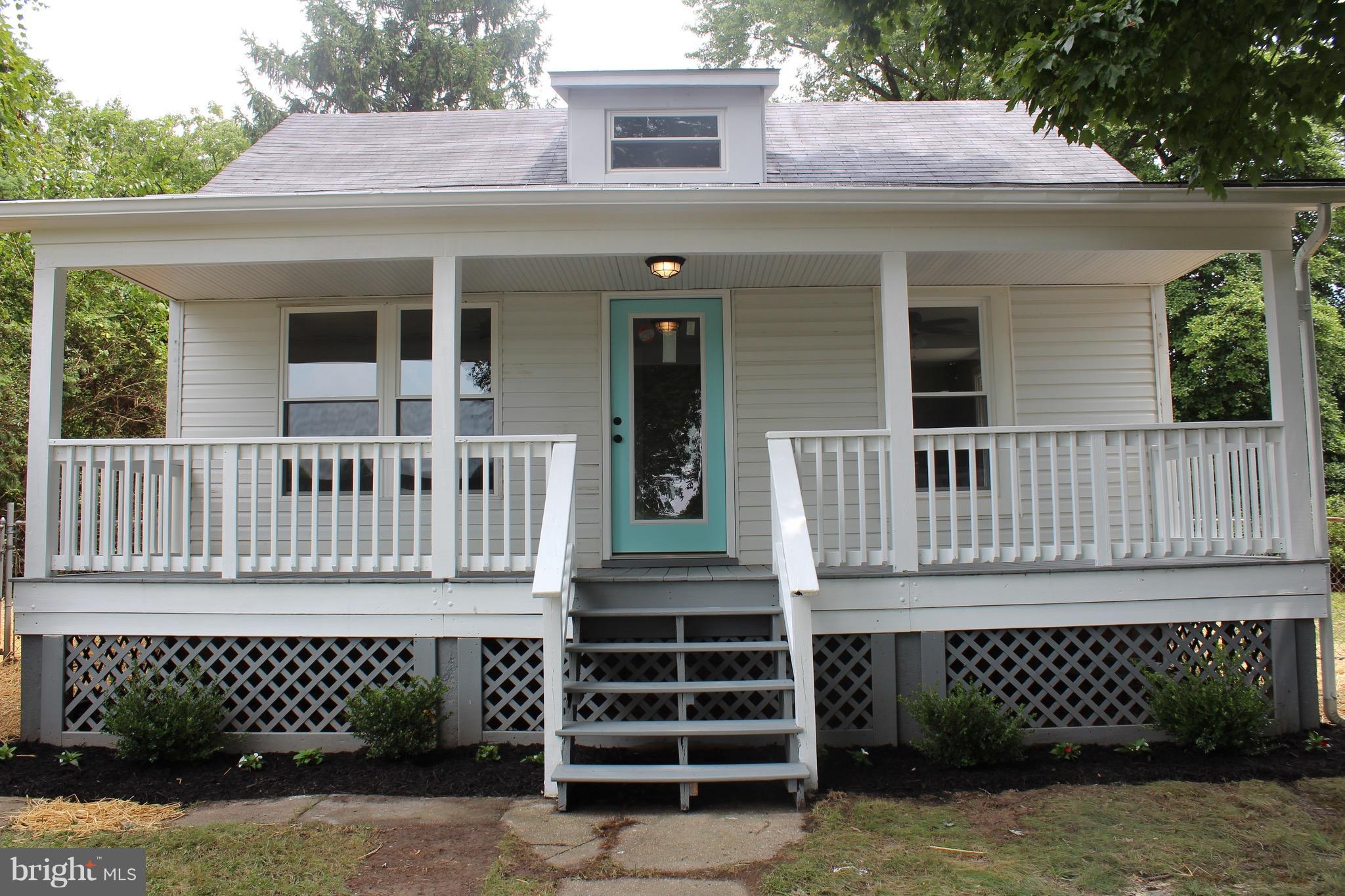 7530 East Battle Grove Road Dundalk, MD 21222 - Photo 21 of 27 front view of a house with a deck