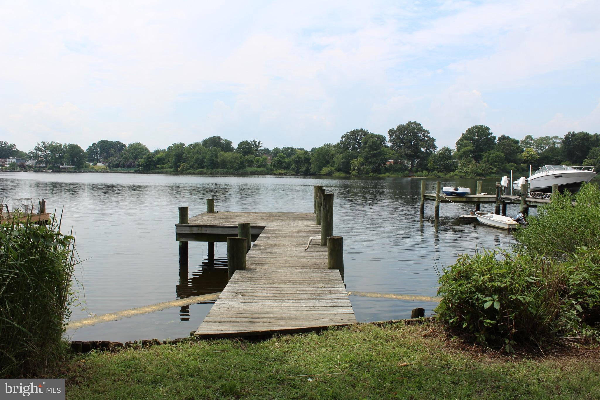 7530 East Battle Grove Road Dundalk, MD 21222 - Photo 23 of 27 a view of a lake with houses