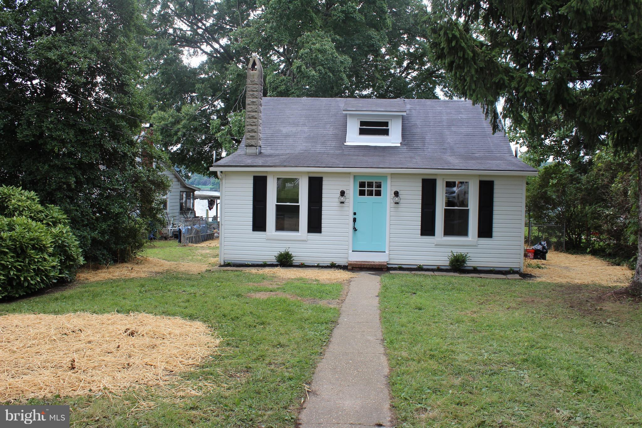 7530 East Battle Grove Road Dundalk, MD 21222 - Photo 24 of 27 a front view of a house with a yard
